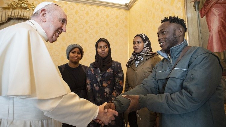 File photo of Pope Francis greeting refugees in the Vatican