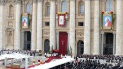 The images of John Paul II and John XXIII hanging from the facade of St Peter's during the canonization Mass in 2014