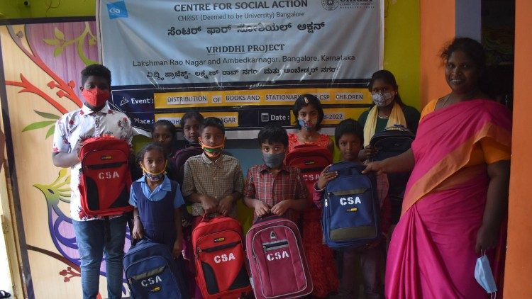 Children receiving stationery supplies under the Child Sponsorship Program