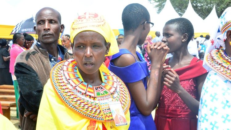 Catholic faithful in traditional dress at the ordination in Maralal Diocese.