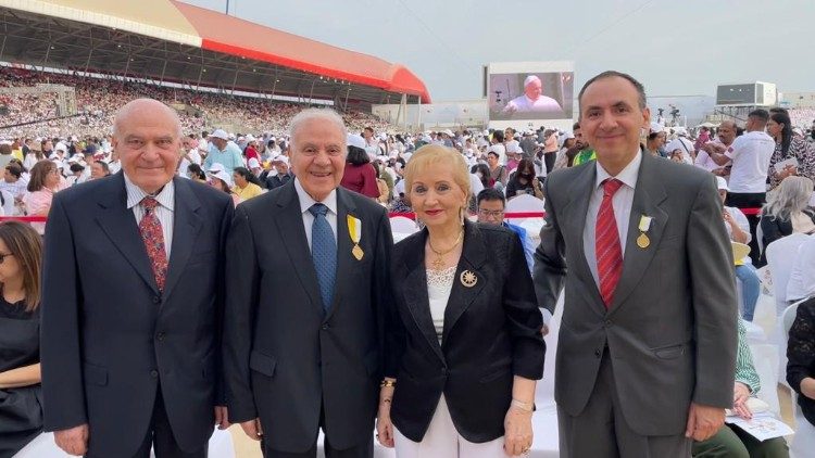 Mr. Nadhim Hanna Al-Sheikh (second from left) with his family at the Pope's Mass in Bahrain