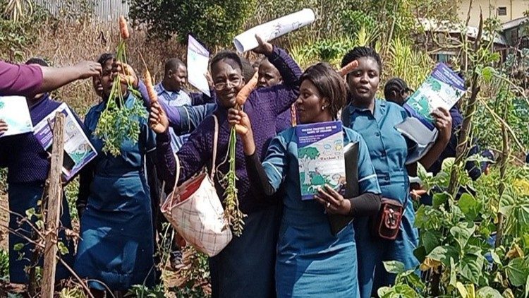 Students harvest carrots from the school garden during Laudato Si’ training at the Catholic School of Health Sciences, Shisong, Cameroon