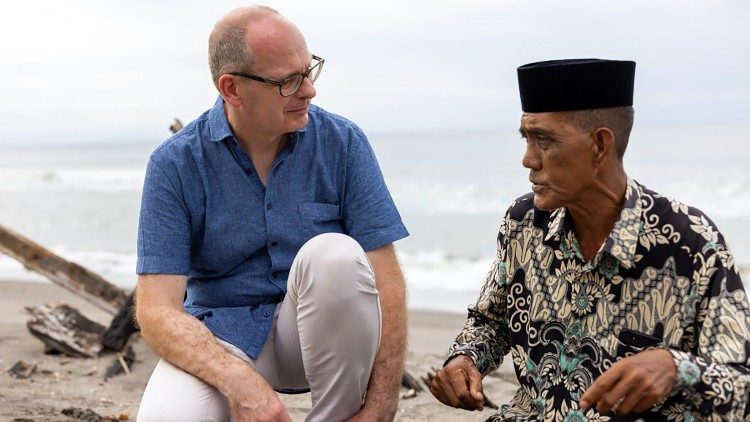 Brother Michael Schöpf speaks with a local traditional leader who welcomed Rohingya Refugees, in Aceh, Indonesia, July 2023
