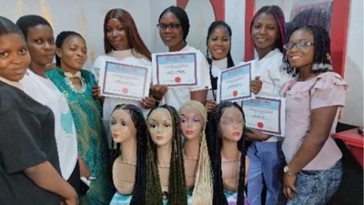 Some victims showing their certificates after complection of their training