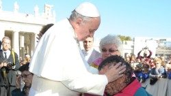 Pope Francis embraces Vinicio Riva in 2013