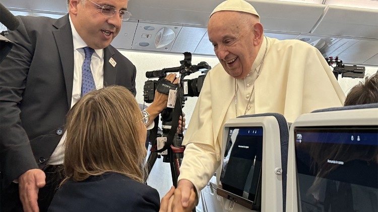 Pope Francis greets Linda Bordoni aboard the papal plane during his Apostolic Journey to Asia and Oceania in September 2024