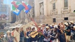 Young Pilgrims raise the South African flag in Rome