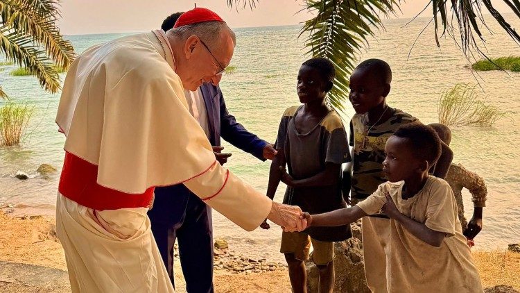 Cardinal Parolin greeting children during his visit to Burundi