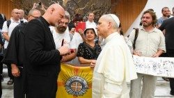 Fr. Piotr Zelazko speaks with Pope Leo at the Wednesday General Audience