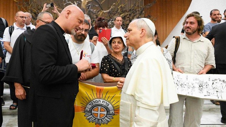 Fr. Piotr Zelazko speaks with Pope Leo at the Wednesday General Audience