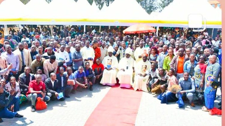 Participants in the Congress pose for a group photo after Mass