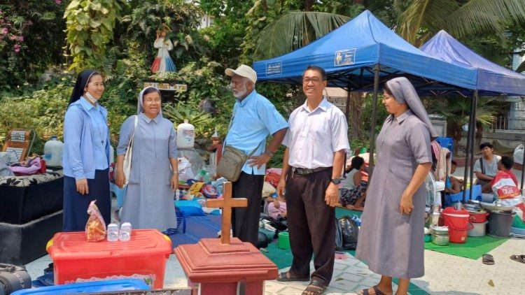 Church workers provide comfort and assistance to earthquake survivors sheltering in the grounds of a religious compound in Myanmar. Photo: