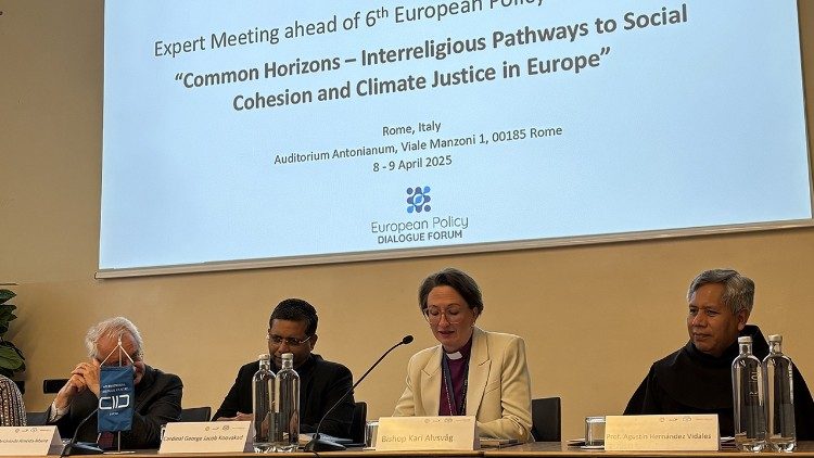 Bishop Alvsvåg, second from right, addresses the conference