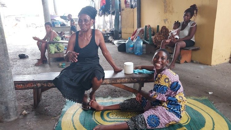 Family member helping granddaughter with cerebral palsy and her physical therapy