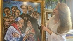 Художничката Милена Велчева с картината " Прегръдката на мира"