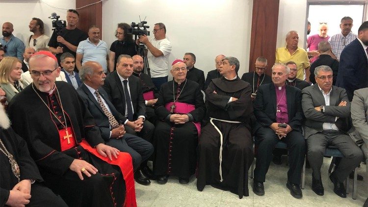 Christian leaders (including Fr Faltas, seated third from right) gather in Taybeh