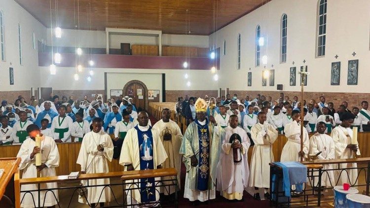 Bishop Vanqa with young people in the Diocese of Queenstown