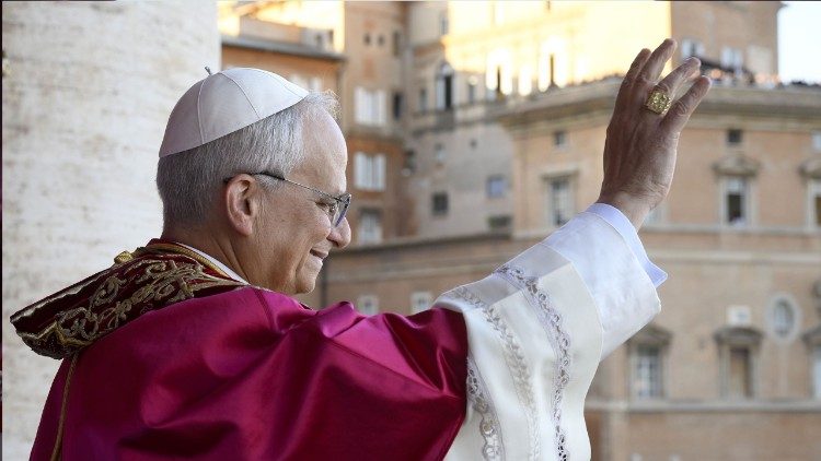 Pope Leo XIV greets pilgrims gathered in St Peter's Square during his first appearance at the Loggia delle Benedizioni on 8 May 2025