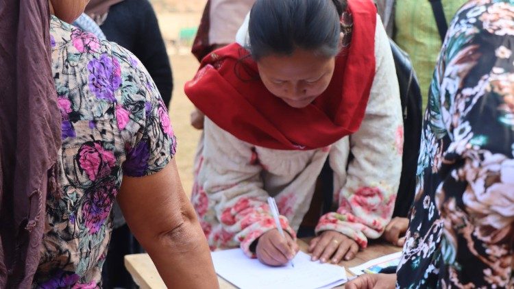 A woman signs in for the training programme at St. Thomas Parish in Singngat, India, on March 1, 2025