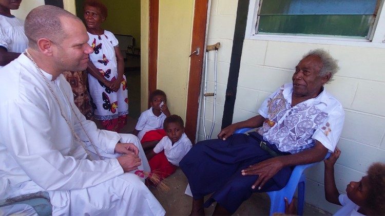 Fr Ravaioli with relatives of the Blessed Peter To Rot