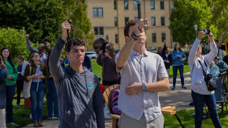 Young people pray the rosary