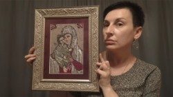 iryna-plekhova-and-her-hand-embroidered-icon-a-replica-of-a-lost-family-relic.jpg