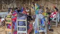 In a neighborhood in Bamenda, Northwest Region of Cameroon, a Caritas staff trains a group of women on business skills. The training is part of the livelihood component of the Anglophone Crisis Emergency Response project (ACER). Photo by Eugene Ringnyuy/CRS