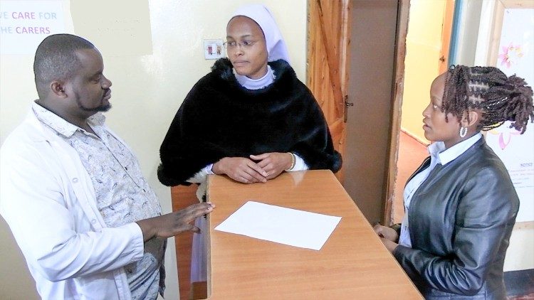 Sr. Purity Mathenge consulting with Kelvin Mwega and Ann Wangari, staff at Holy Innocents BPSS centre