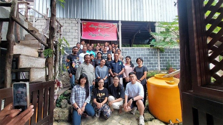 Visitors from Jakarta pose with local volunteers and young people at the St. Brigitta Learning Centre in Bombay village on Kei Besar Island, Southeast Maluku.