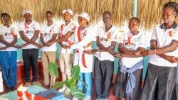 Sr. Mbuli and health workers in a moment of solidarity during a briefing