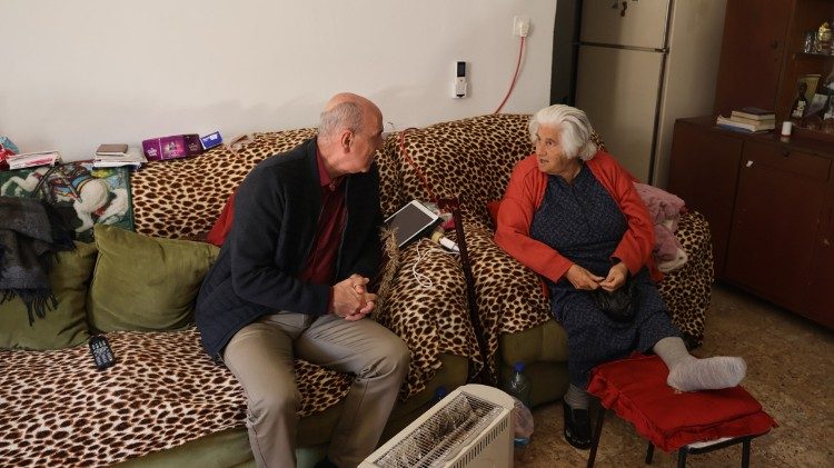 CNEWA’s Joseph Hazboun visits beneficiaries receiving hot meals in the West Bank.