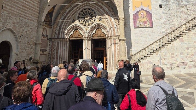 Pilgrims queue to enter Assisi's lower basilica